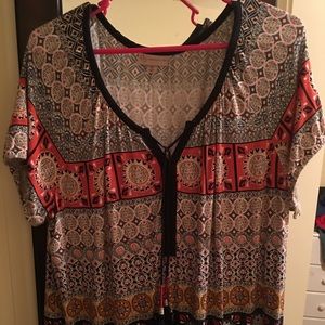 Cute stretchy top. Busy, tribal type design